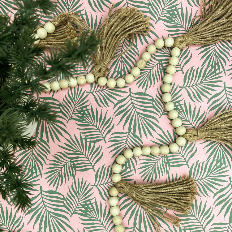 Pink wrapping paper with green palm leaves